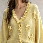 Viola – neuletakki röyhelöillä ja rusetilla